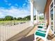 Outdoor porch area with ample seating and views of the community golf greens at 6834 Fairview Ter # 6834, Bradenton, FL 34203