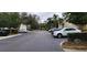 Community street view featuring well-maintained landscaping and ample parking at 6834 Fairview Ter # 6834, Bradenton, FL 34203