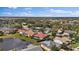 Panoramic aerial view of the neighborhood featuring homes with pools, lush landscaping, and scenic lakes at 6955 Stetson Street Cir, Sarasota, FL 34243