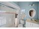 Bathroom featuring a walk-in shower and white vanity at 6955 Stetson Street Cir, Sarasota, FL 34243