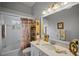 Bathroom featuring a bathtub, shower, and linen storage at 6955 Stetson Street Cir, Sarasota, FL 34243