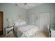 Cozy bedroom features neutral carpeting and a ceiling fan at 6955 Stetson Street Cir, Sarasota, FL 34243