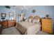Spacious primary bedroom with a ceiling fan and light blue walls at 6955 Stetson Street Cir, Sarasota, FL 34243