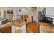 Stylish kitchen with stainless steel appliances, stone countertops, and white cabinets at 6955 Stetson Street Cir, Sarasota, FL 34243