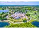 An aerial view shows the clubhouse and the surrounding golf course and lakes at Lakewood Ranch at 7210 Desert Ridge Gln, Lakewood Ranch, FL 34202