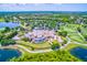 An aerial shot showing a resort style community with ponds and golf courses on a sunny day at 7210 Desert Ridge Gln, Lakewood Ranch, FL 34202