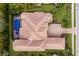 Aerial view of a home showcasing an expansive terracotta roof, sparkling pool, manicured landscaping, and brick driveway at 7210 Desert Ridge Gln, Lakewood Ranch, FL 34202