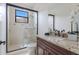 Elegant bathroom featuring a glass-enclosed shower and granite countertop vanity at 7210 Desert Ridge Gln, Lakewood Ranch, FL 34202