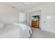 Neutral bedroom showing a dresser and a television with a beach image at 7210 Desert Ridge Gln, Lakewood Ranch, FL 34202