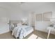 Simple bedroom with a comfortable bed with soft colored bedding and minimal decorations and furnishings at 7210 Desert Ridge Gln, Lakewood Ranch, FL 34202