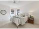 Bright bedroom with a decorative metal bed frame and large windows at 7210 Desert Ridge Gln, Lakewood Ranch, FL 34202