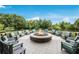 Inviting outdoor fire pit area with comfortable seating and a picturesque setting at 7210 Desert Ridge Gln, Lakewood Ranch, FL 34202