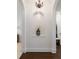 Bright hallway featuring hardwood floors, neutral paint, and lovely archways at 7210 Desert Ridge Gln, Lakewood Ranch, FL 34202