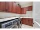 Modern laundry room with front loading machines and plenty of cabinet storage at 7210 Desert Ridge Gln, Lakewood Ranch, FL 34202