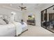 Bright and serene main bedroom with a sitting area and access to outdoor entertainment at 7210 Desert Ridge Gln, Lakewood Ranch, FL 34202