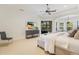 Serene main bedroom features tray ceiling, neutral tones, and a private seating area at 7210 Desert Ridge Gln, Lakewood Ranch, FL 34202