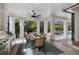 Inviting covered outdoor dining area with a summer kitchen and views of the pool at 7210 Desert Ridge Gln, Lakewood Ranch, FL 34202