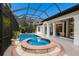 Luxurious pool and spa in a screened-in enclosure with beautiful water features at 7210 Desert Ridge Gln, Lakewood Ranch, FL 34202