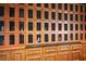 Private wine lockers with custom wood cabinetry and secure mesh doors at 7210 Desert Ridge Gln, Lakewood Ranch, FL 34202
