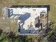 Birds-eye view of the concrete foundation showcasing the layout of an unfinished residence at 7407 226Th E St, Bradenton, FL 34211