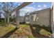 Exterior view of block construction and exposed framing with vegetation visible at 7407 226Th E St, Bradenton, FL 34211