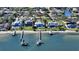 Aerial view of stunning waterfront homes with private docks and beach access at 7706 Desoto Memorial Hwy, Bradenton, FL 34209