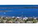Stunning aerial view of waterfront homes with private docks and boatlifts surrounded by the serene waters of Tampa Bay at 7706 Desoto Memorial Hwy, Bradenton, FL 34209