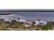 Waterfront property featuring a traditional home design and gorgeous bay views at 7706 Desoto Memorial Hwy, Bradenton, FL 34209