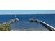 Waterfront property boasts two private docks for convenient boat access and stunning views of the bay at 7706 Desoto Memorial Hwy, Bradenton, FL 34209