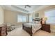 Inviting bedroom with plush carpeting, tray ceilings, and lots of natural light at 7706 Desoto Memorial Hwy, Bradenton, FL 34209