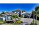A beautiful traditional-style home featuring a paver driveway and professional landscaping at 7706 Desoto Memorial Hwy, Bradenton, FL 34209