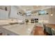 Gourmet kitchen island featuring white cabinets, stainless appliances, and eat-in counter seating at 7706 Desoto Memorial Hwy, Bradenton, FL 34209