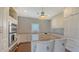 Bright kitchen features granite countertops, stainless steel appliances and ample cabinet storage at 7706 Desoto Memorial Hwy, Bradenton, FL 34209