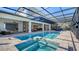 Beautiful covered pool and spa with brick pavers, open to the home's living areas at 7706 Desoto Memorial Hwy, Bradenton, FL 34209