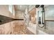 Detailed view of the luxurious tiled shower with multiple showerheads and built-in seating at 7706 Desoto Memorial Hwy, Bradenton, FL 34209