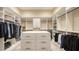 Spacious walk-in closet featuring custom shelving, drawers, and ample storage at 7706 Desoto Memorial Hwy, Bradenton, FL 34209