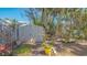 Backyard shed surrounded by plants and pots is perfect for outdoor storage at 813 Plymouth St, Sarasota, FL 34242