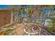 Peaceful backyard view featuring winding pathways and colorful potted plants at 813 Plymouth St, Sarasota, FL 34242