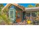 Charming home exterior showcasing a decorative wood front door and vibrant green trim at 813 Plymouth St, Sarasota, FL 34242