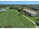 Aerial view of condominium featuring manicured golf course views and mature landscaping at 8735 Olde Hickory Ave # 8303, Sarasota, FL 34238