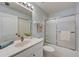 Bright bathroom with a vanity, sink, and shower at 8735 Olde Hickory Ave # 8303, Sarasota, FL 34238