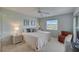 Bright bedroom featuring twin beds, neutral decor, and natural light at 8735 Olde Hickory Ave # 8303, Sarasota, FL 34238