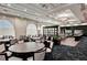 Large dining room area with round tables and chairs for large parties at 8735 Olde Hickory Ave # 8303, Sarasota, FL 34238