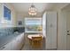 Bright kitchen nook with a small table, natural light, and ample storage space at 8735 Olde Hickory Ave # 8303, Sarasota, FL 34238
