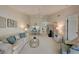 Bright living room with neutral colors, vaulted ceilings, and plush carpeting at 8735 Olde Hickory Ave # 8303, Sarasota, FL 34238