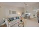 Inviting living room with a dining area, comfortable seating, and calming decor at 8735 Olde Hickory Ave # 8303, Sarasota, FL 34238