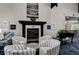 Lounge area featuring comfortable seating, a fireplace, and a piano at 8735 Olde Hickory Ave # 8303, Sarasota, FL 34238