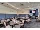Comfortable dining room featuring table seating, booth seating, and a TV at 8735 Olde Hickory Ave # 8303, Sarasota, FL 34238