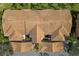 Overhead view of building rooftops, complex landscaping and palm trees at 923 Fairwaycove Ln # 103, Bradenton, FL 34212