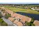 The view from above showcases the condo community, overlooking the golf course and pond views at 923 Fairwaycove Ln # 103, Bradenton, FL 34212